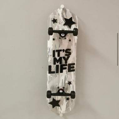Skateboard wall art. These pieces of skateboard wall art are custom made for clients, they have bespoke designs such as music themes. Available in various colours and styles.